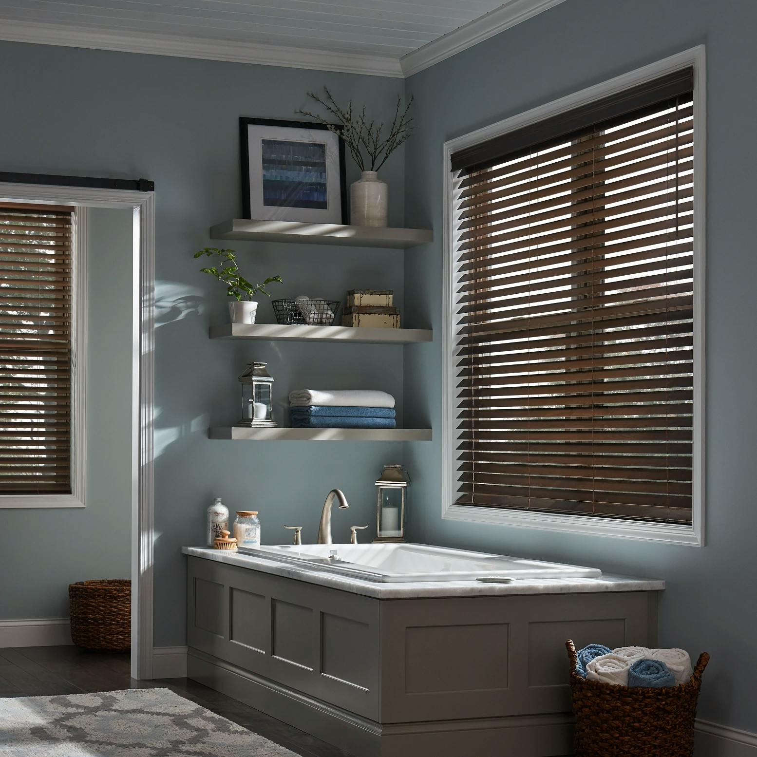 Wood blinds featured in a modern bathroom.